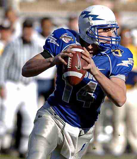 American football helmet in the hand
